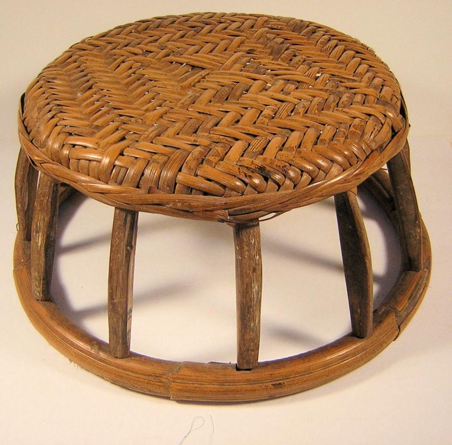 Woven seat with wooden legs.  15 diameter, 6 ½ inches tall.-image